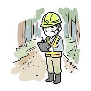 森林の中で反射ベストを着てタブレット端末を操作するヘルメット姿の林業作業員